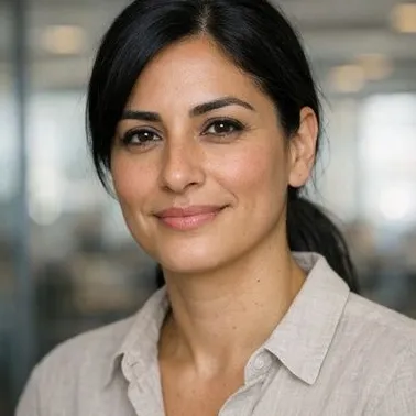 Woman mid-30s olive skin sleek black ponytail neutral shirt calm expression